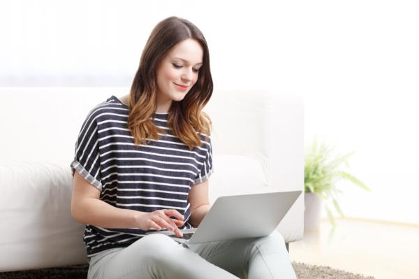 Woman typing on computer airport secrets