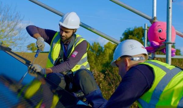 Octopus Energy engineers install a solar panel