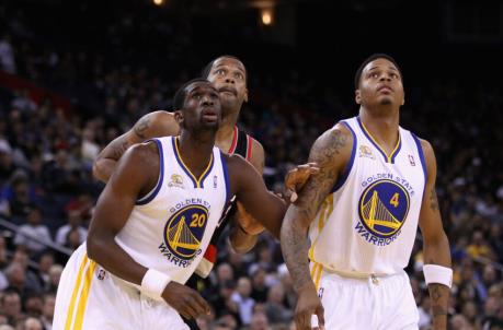 OAKLAND, CA - FEBRUARY 15: Ekpe Udoh #20 and Brandon Rush #4 of the Golden State Warriors go for a rebound against Marcus Camby #23 of the Portland Trail Blazers at Oracle Arena on February 15, 2012 in Oakland, California. NOTE TO USER: User expressly acknowledges and agrees that, by downloading and or using this photograph, User is co<em></em>nsenting to the terms and co<em></em>nditions of the Getty Images License Agreement. (Photo by Ezra Shaw/Getty Images) 