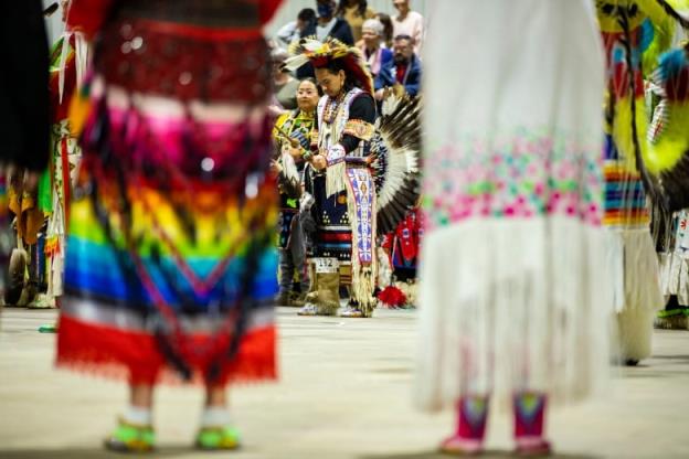 Dancers enter the powwow arena for Grand Entry.