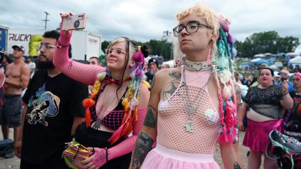 A group of fans pose together at the 2023 Gathering of the Juggalos