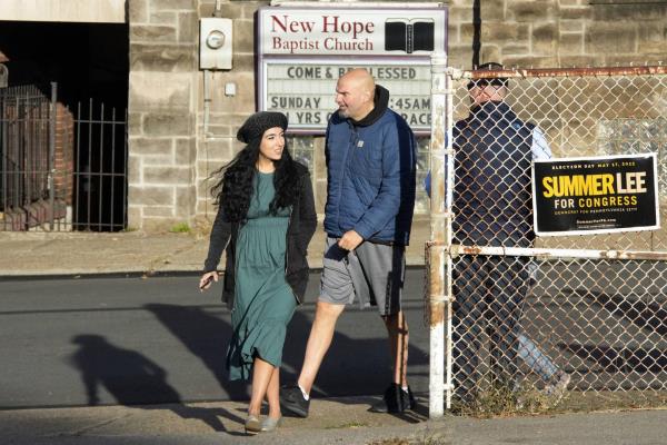 Pennsylvania Lt. Gov. John Fetterman, Democratic candidate for U.S. Senate from Pennsylvania, center, and wife Gisele, left, arrive to vote in Braddock , Pa, Tuesday, Nov. 8, 2022. 