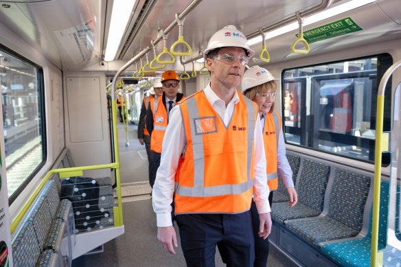 Premier Chris Minns and Transport Minister Jo Haylen board a new metro train that is undergoing testing on the main section of the City and Southwest line.