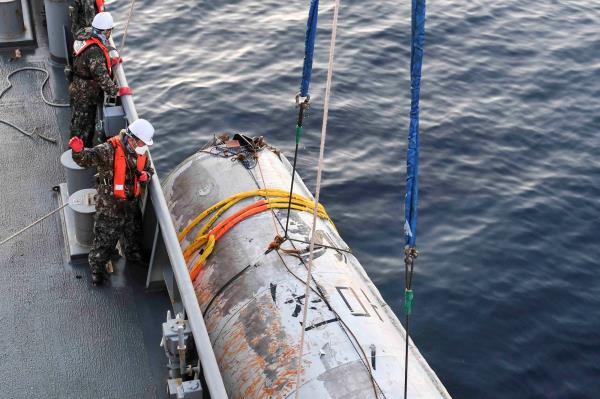 A handout picture shows part of what is believed to be a space launch vehicle that North Korea said crashed into the sea off the west coast of the divided peninsula, and which the South Korean military had salvaged, on June 15. | THE DEFENSE MINISTRY / HANDOUT VIA REUTERS