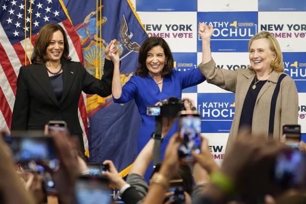 Vice President Kamala Harris (left) New York Gov. Kathy Hochul (center) and former Secretary of State Hillary Clinton (right) stand together on stage during a campaign event for Hochul, Thursday, Nov. 3, 2022, at Barnard College in Manhattan, New York. 