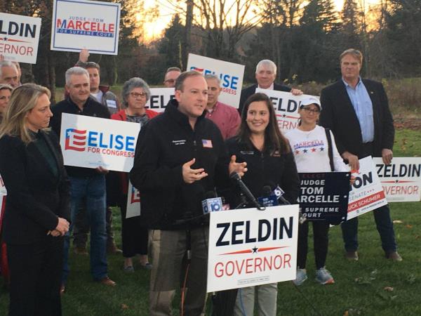 Rep. Lee Zeldin, R-N.Y. (center left) the Republican candidate for governor in New York, is joined by Rep. Elsie Stefanik, R-N.Y. (right of Zeldin) at a rally on Thursday, Nov. 3, 2022 in Rensselaer County, New York.