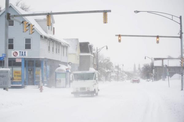 A postal truck makes its way down Grant Street during a snowstorm, Saturday, Nov. 19, 2022 in Buffalo, N.Y.  Residents of northern New York state are digging out from a dangerous lake-effect snowstorm that had dropped nearly 6 feet of snow in some areas and caused three deaths. The Buffalo metro area was hit hard, with some areas south of the city receiving more than 5 feet by early Saturday.