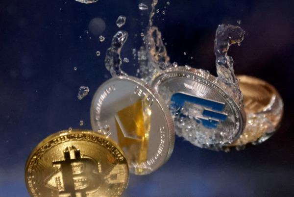 Illustration shows representations of cryptocurrencies plunging into water