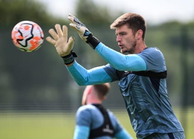 Goalkeeper Nick Pope catches a ball during a Newcastle United training session