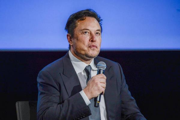 Elon Musk looks up as he addresses guests at the Offshore Northern Seas 2022 (ONS) meeting in Stavanger, Norway on August 29, 2022. 