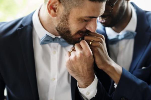 Two men embracing on their wedding day