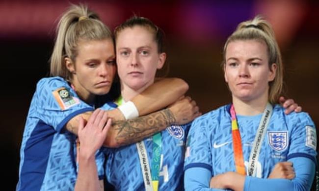 Keira Walsh is embraced by Rachel Daly as Lauren Hemp stands by