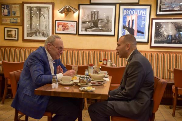 Sen. Chuck Schumer, left, and Rep. Hakeem Jeffries are pictured at Junior's Restaurant in Brooklyn on Tuesday, Jan. 17, 2022, and discussed their plans to court moderate Republicans in the newly divided federal government.