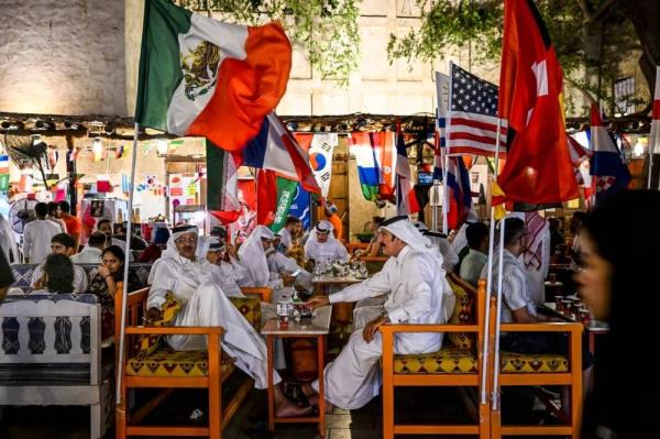  In this file photo taken on November 19, 2022 People drink coffee at the Souq Waqif marketplace in Doha ahead of the Qatar 2022 World Cup football tournament. - Mo<em></em>nths after hundreds of thousands of football fans packed into its hotels and stadiums, Qatar is seeking to remedy a bout of the post-World Cup blues by hosting more internatio<em></em>nal events. Along with the departed football crowds, thousands of foreign workers left the Gulf state after Lio<em></em>nel Messi lifted the coveted trophy on December 18. Many of those who stayed on are counting the cost. - Pic: AFP