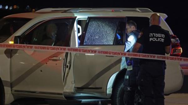 Israeli security forces examine a vehicle riddled with bullet holes, after an Israeli-American citizen was shot near Jericho in the occupied West Bank on February 27.