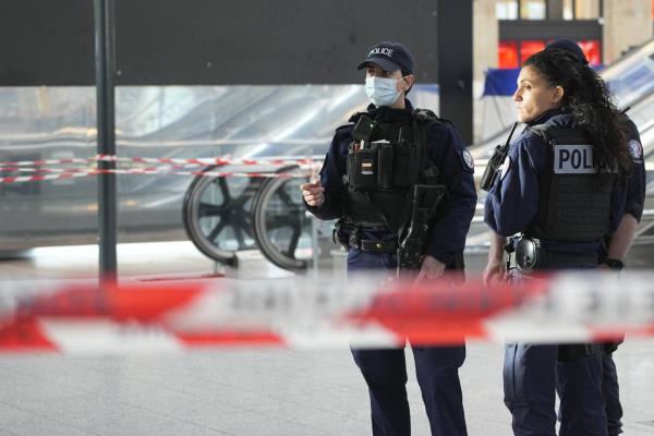 Police officers patrol at the Gare du Nord train station, Wednesday, Jan. 11, 2023 in Paris.