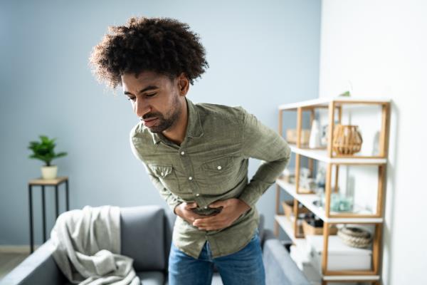 Man with stomach pain experiencing indigestion