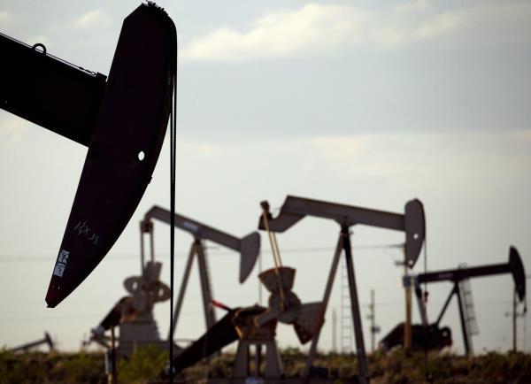 FILE - Pump jacks work in a field near Lovington, N.M., April 24, 2015. New Mexico oilfield and air quality regulators on Thursday, June 29, 2023, announced unprecedented state fines against a Texas-ba<em></em>sed oil and natural gas producer on accusations that the company flouted local pollution reporting and co<em></em>ntrol requirements by burning off vast amounts of natural gas in a prolific energy-production zone in the southeast of the state. (AP Photo/Charlie Riedel, File)