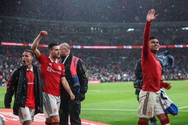 Manchester players celebrate after the FA Cup semi-final match between Brighton and Hove Albion and Manchester United in London, April 23. Pic: EPA