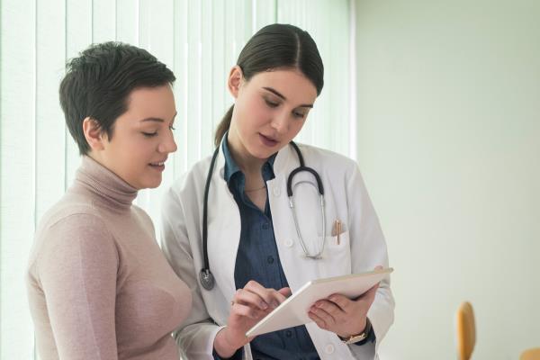 Woman Talking to a Doctor