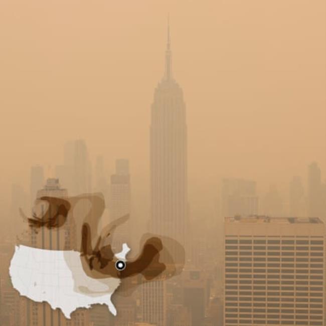 Empire State Building and Manhattan skyline obscured by orange haze