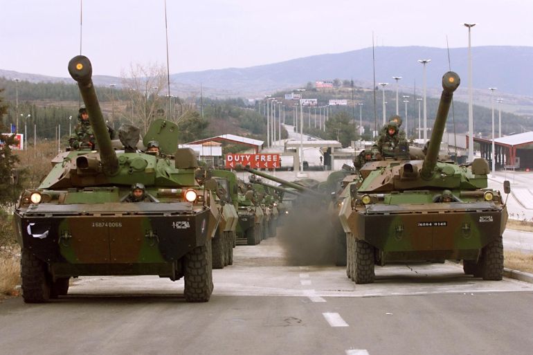 AMX 10 RC tanks of the French First Foreign Cavalry Regiment waits 26 February near the Greek border town of Evzon to enter the Former Yugoslav Republic of Macedo<em></em>nia (FYROM) to join the NATO advance force for Kosovo ba<em></em>sed in Kumanovo. (ELECTRo<em></em>nIC IMAGE). (Photo by Eric Feferberg / AFP)