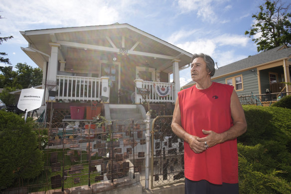 Ben Gallegos stands outside his family’s home in Globeville, Denver as the daytime high soars towards triple digits Fahrenheit on Thursday.