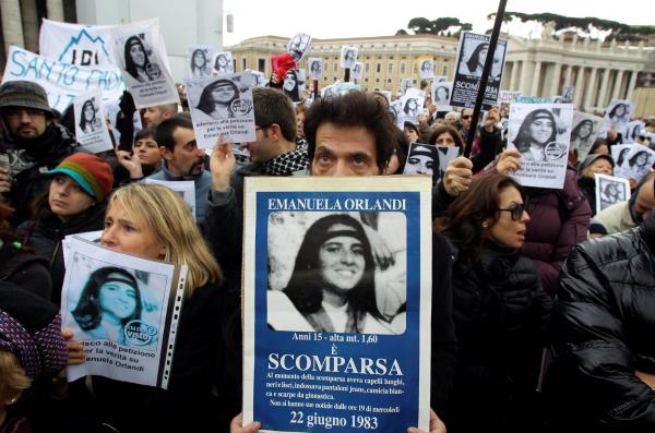 Pietro Orlandi, brother of Emanuela, holds a banner with her picture in St. Peter's square in December 2011.  