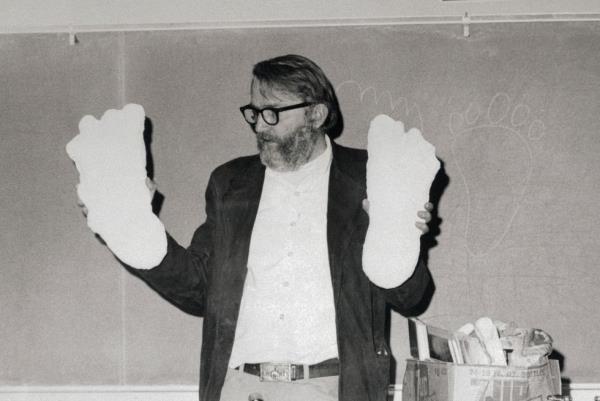 anthropologist grover krantz holding up sasquatch footprint casts