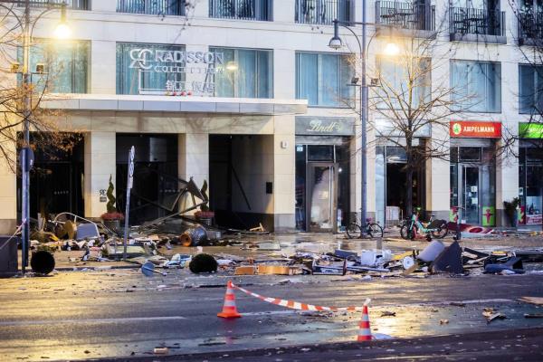 Debris lay on the street after a huge fish tank burst at the Seal Life Aquarium in central Berlin, Germany, Friday, Dec. 16, 2022. 