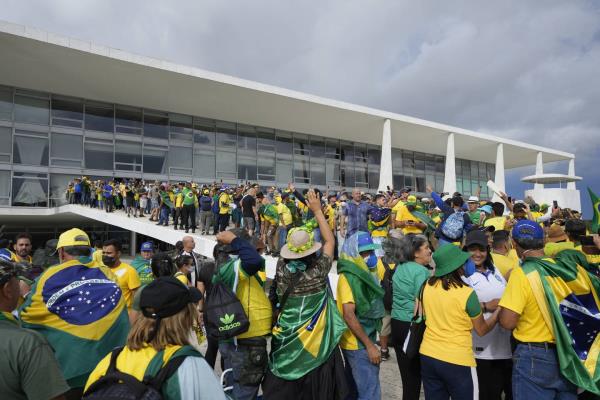 Protesters, supporters of Brazil's former President Jair Bolsonaro, storm the Planalto Palace in Brasilia, Brazil, Sunday, Jan. 8, 2023. Planalto is the official workplace of the president of Brazil.